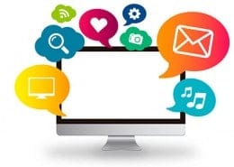 computer with media icons surrounding it