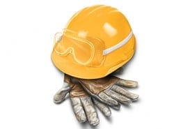 hard hat with safety goggles and work gloves.